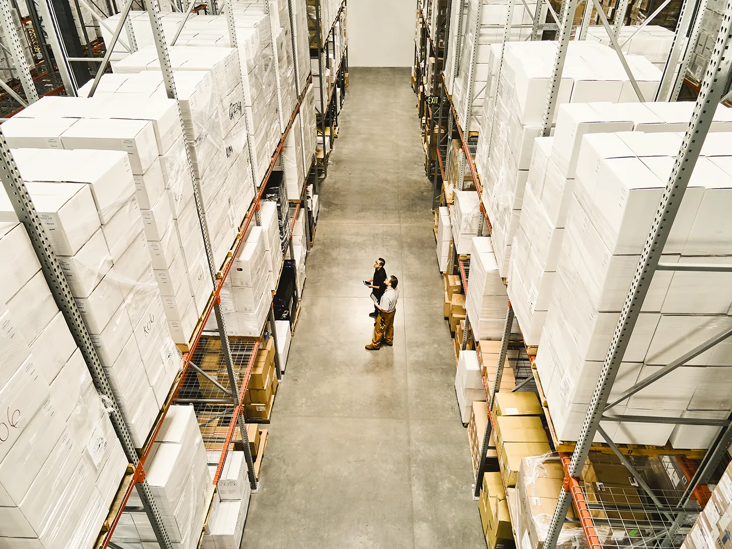 bird's eye view of two men in a warehouse