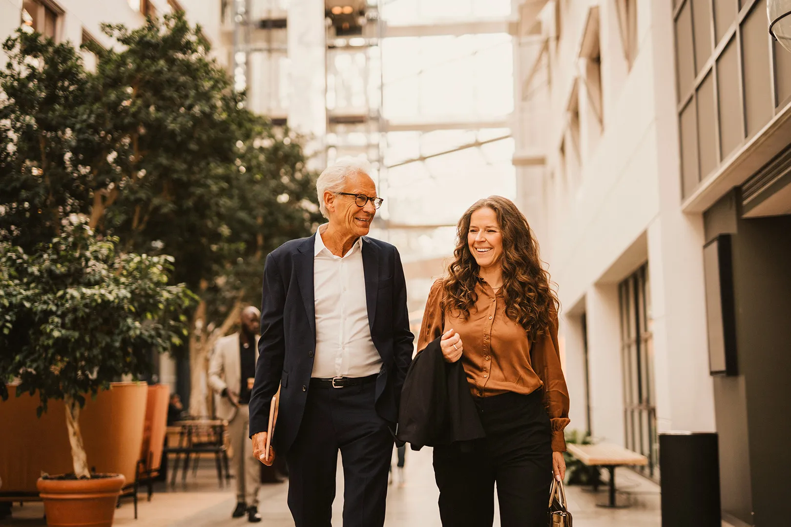 male and female colleague walking together
