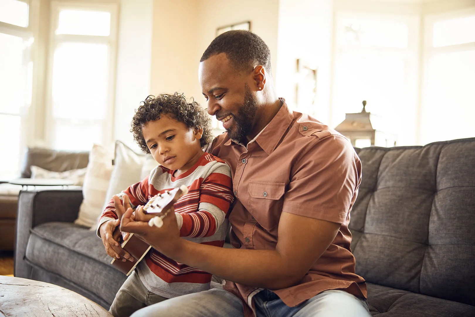 dad and son playing guitar