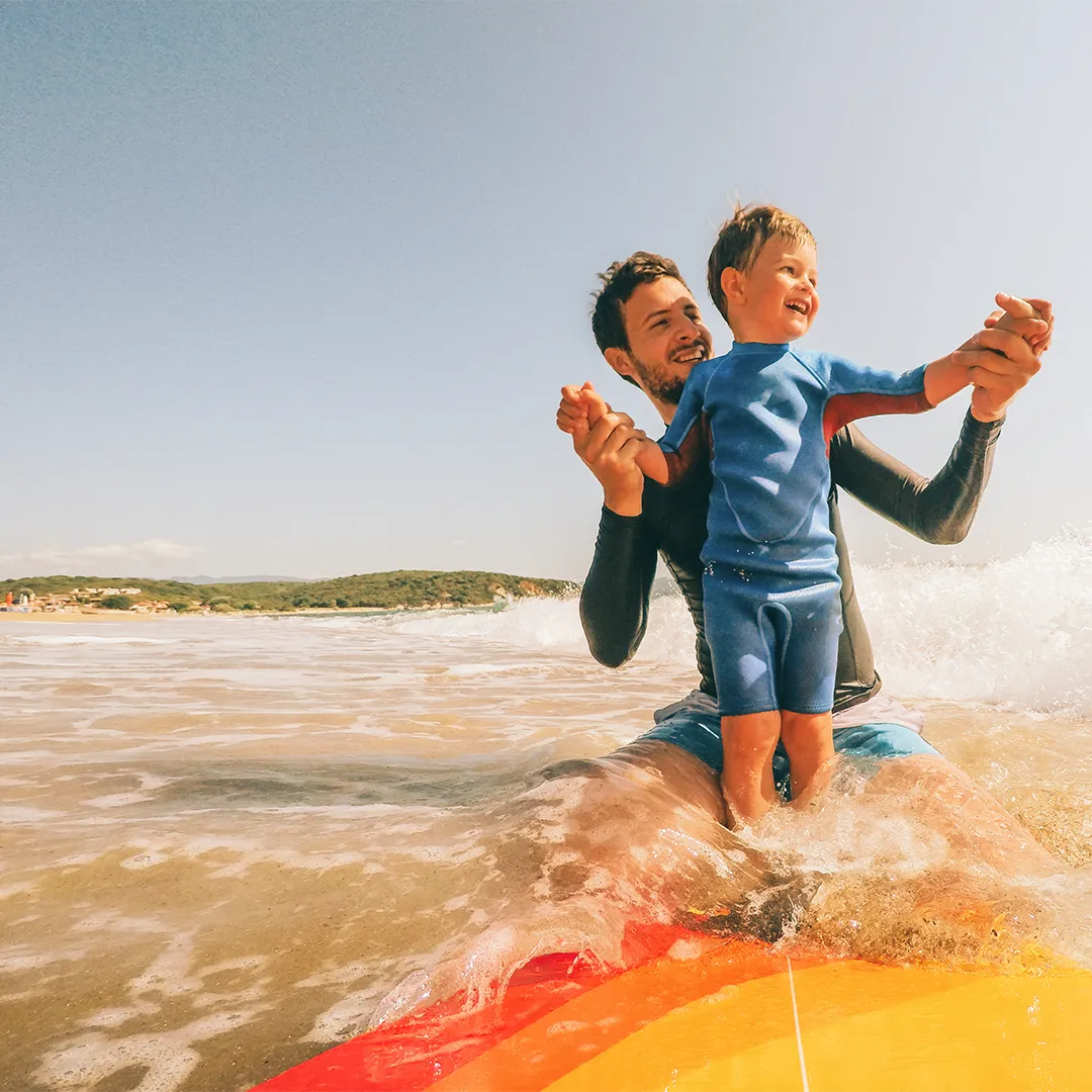 dad and son surfing