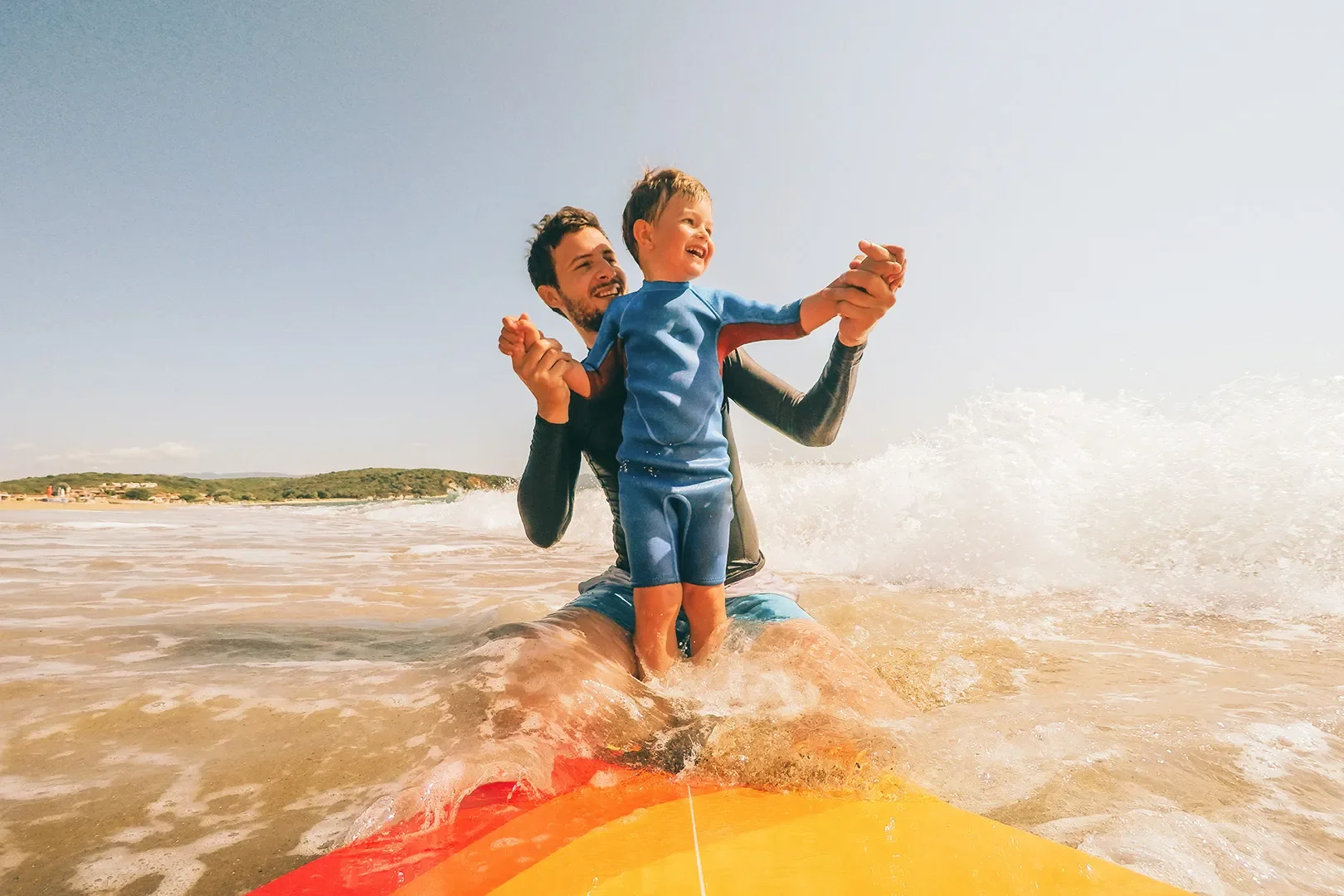 dad and son surfing