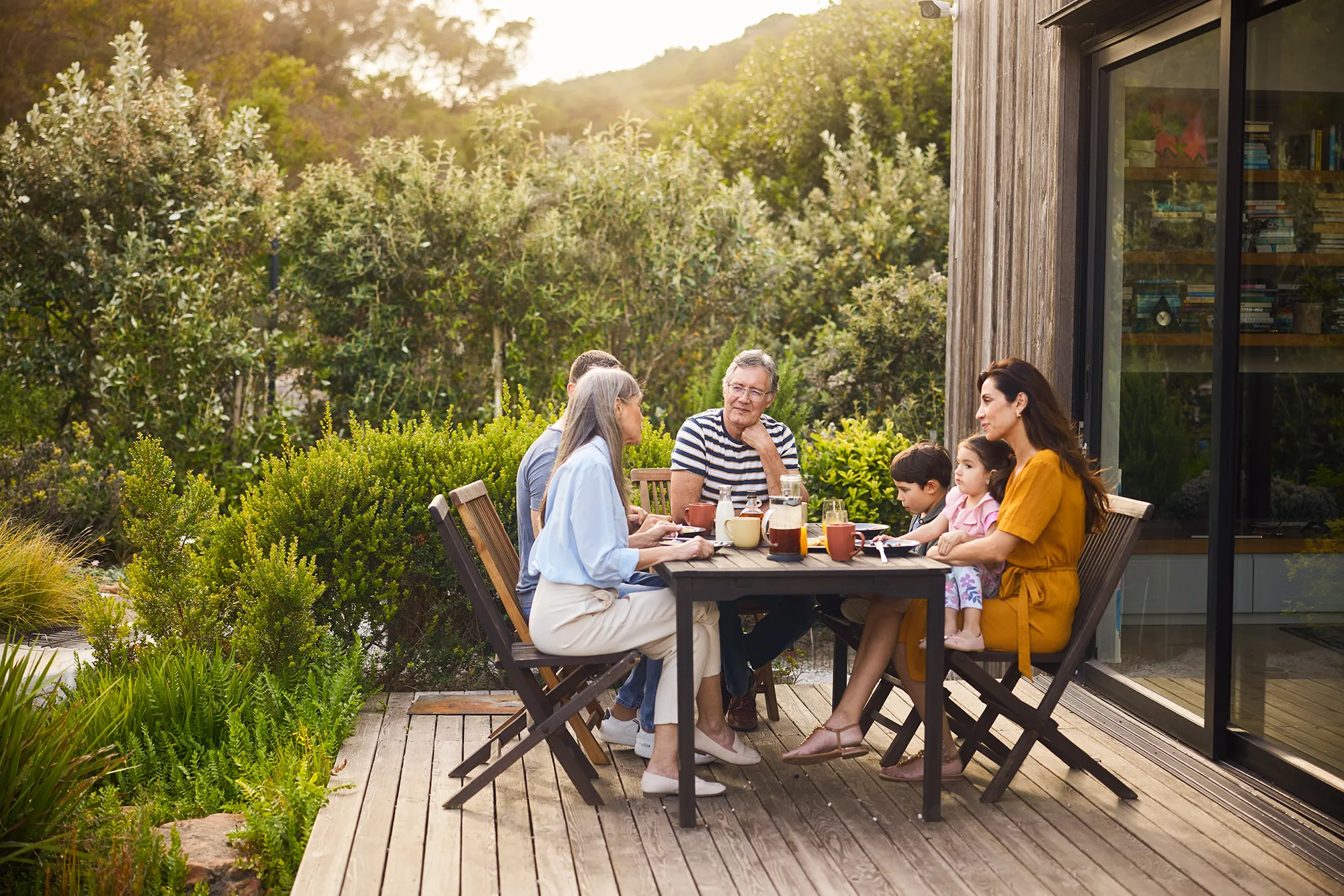 family eating dinner on patio
