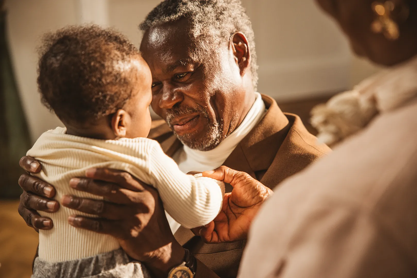 grandfather holding grandson