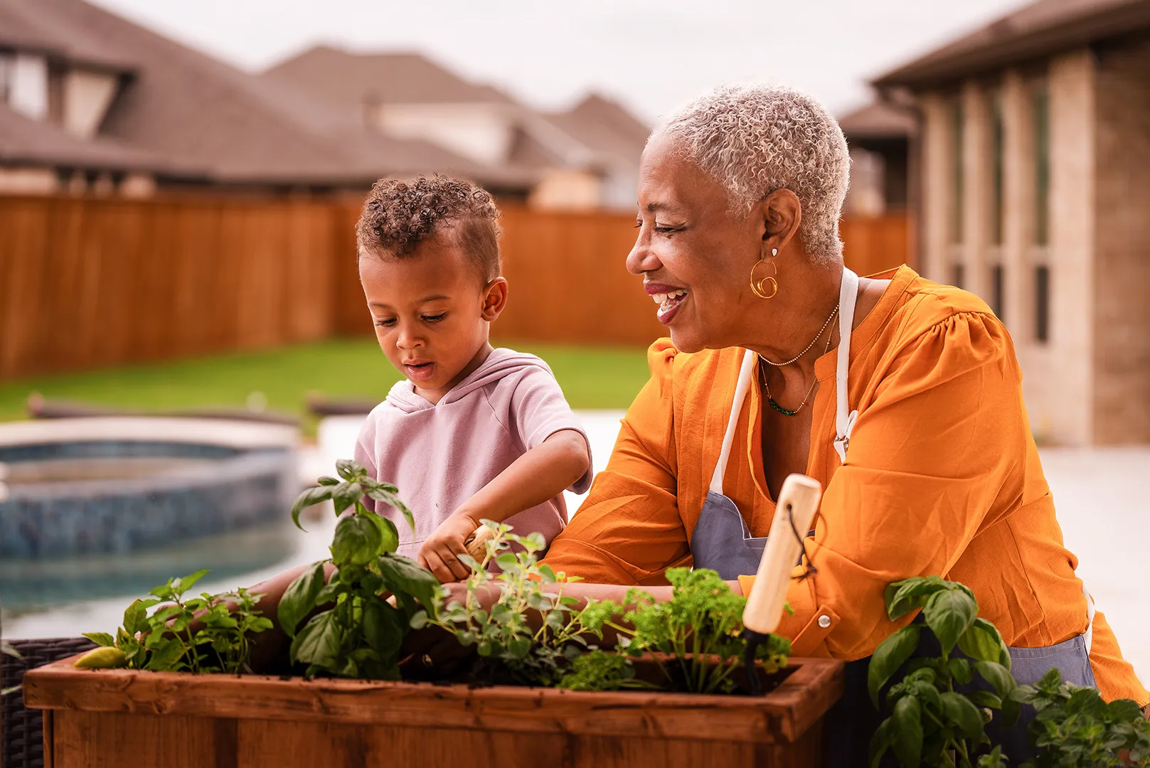 grandmother and grandson planting