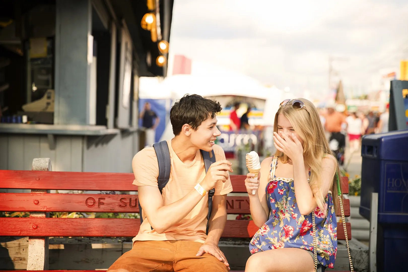 teens at carnival eating ice cream