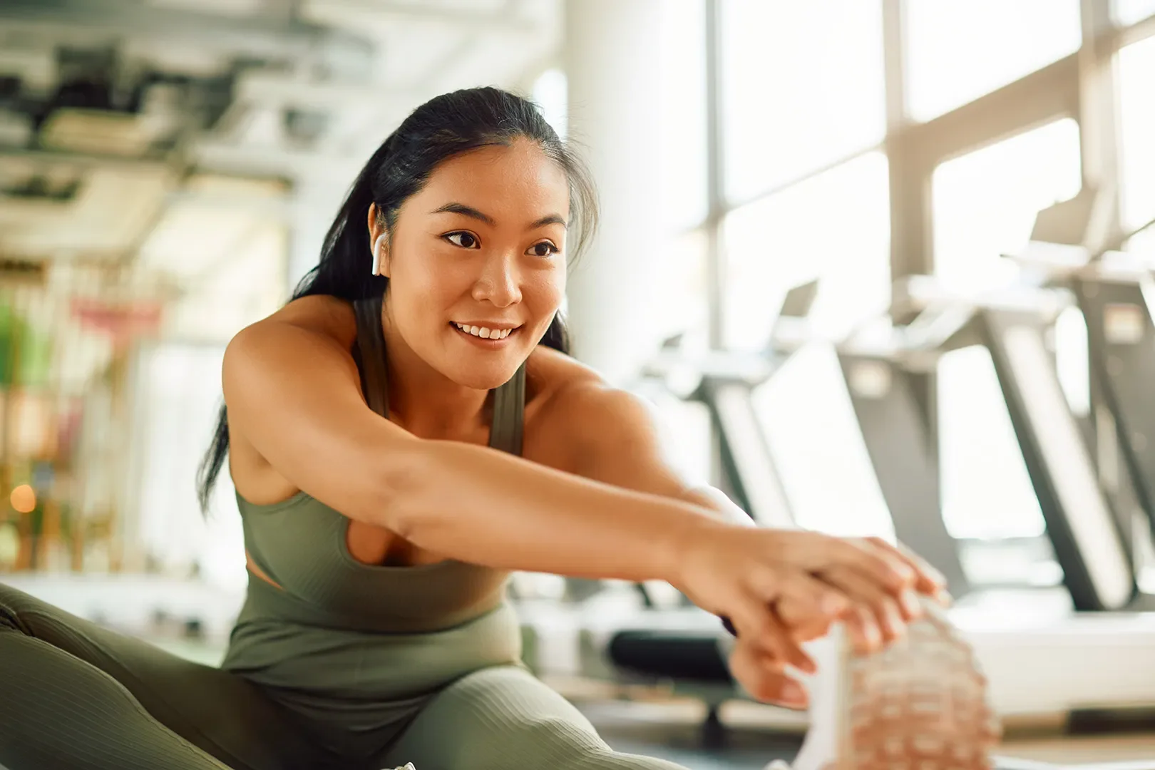 woman stretching at the gym