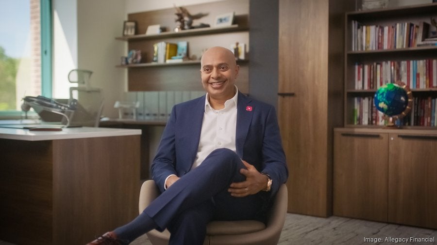 CEO and President Nathanael Tarwasokono smiling and sitting in his office